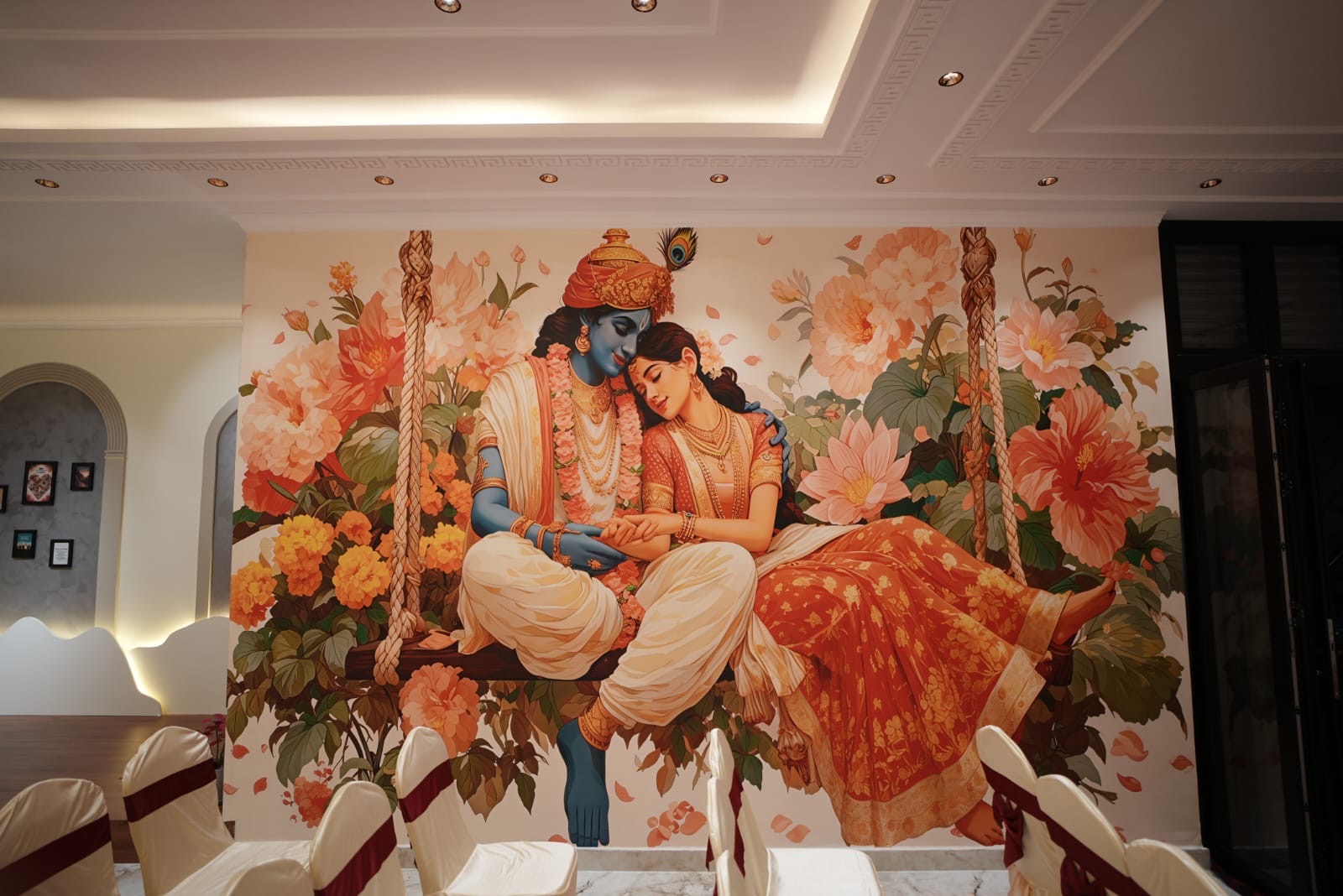 Hand-painted Radha-Krishna mural in the main hall